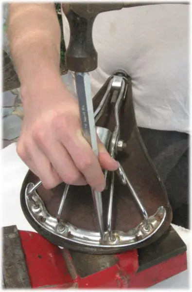 Installing rivets to replace a saddle top or undercarriage