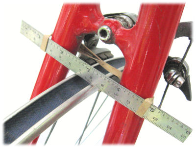 Turing a wheel in the bicycle fram,e using a ruler